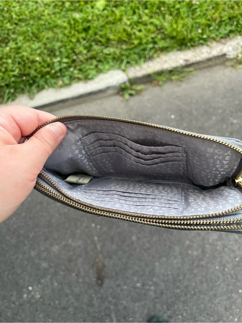 kate spade gray wristlet clutch with gold nameplate
